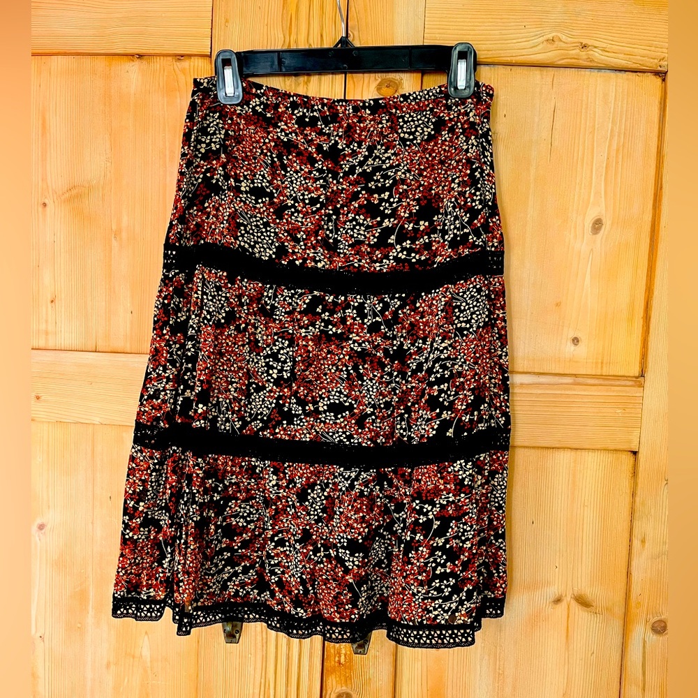 Black/brown/cream tiered peasant skirt with lace detail. Size 2